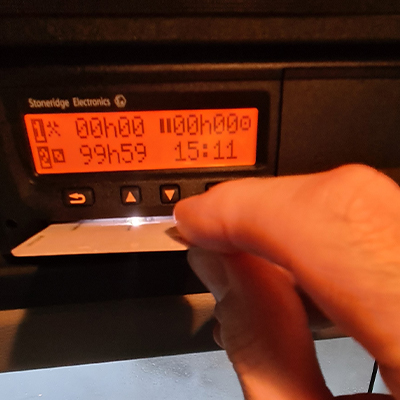 Driver card being inserted into a tachograph