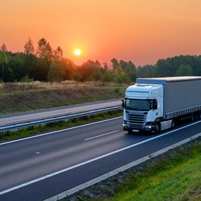 HGV on a motorway at sunset